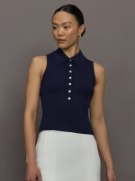 Model wears a navy collared button up tennis tank.
