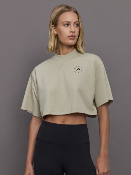 Model wears cropped t-shirt with a boxy fit, dropped shoulders, and a mock neck.