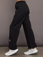 Model is wearing black sweatpants with drawstring and pockets