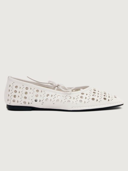 White flat shoe with cut-out design.