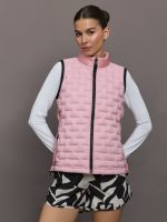 Model wears a tube quilted pastel pink vest with black seams.