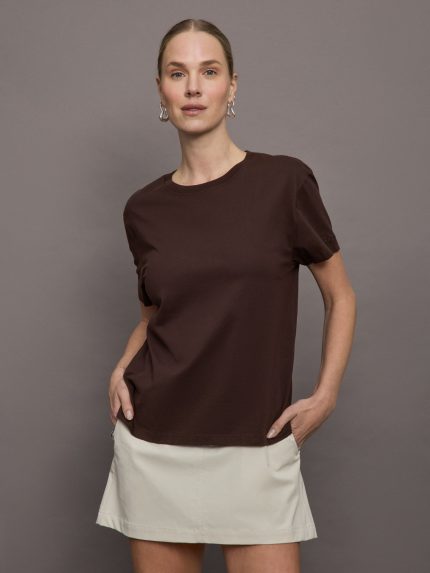 Model wears a basic dark brown tee shirt with ringer neck and the word "Bandier" across the sleeve. 