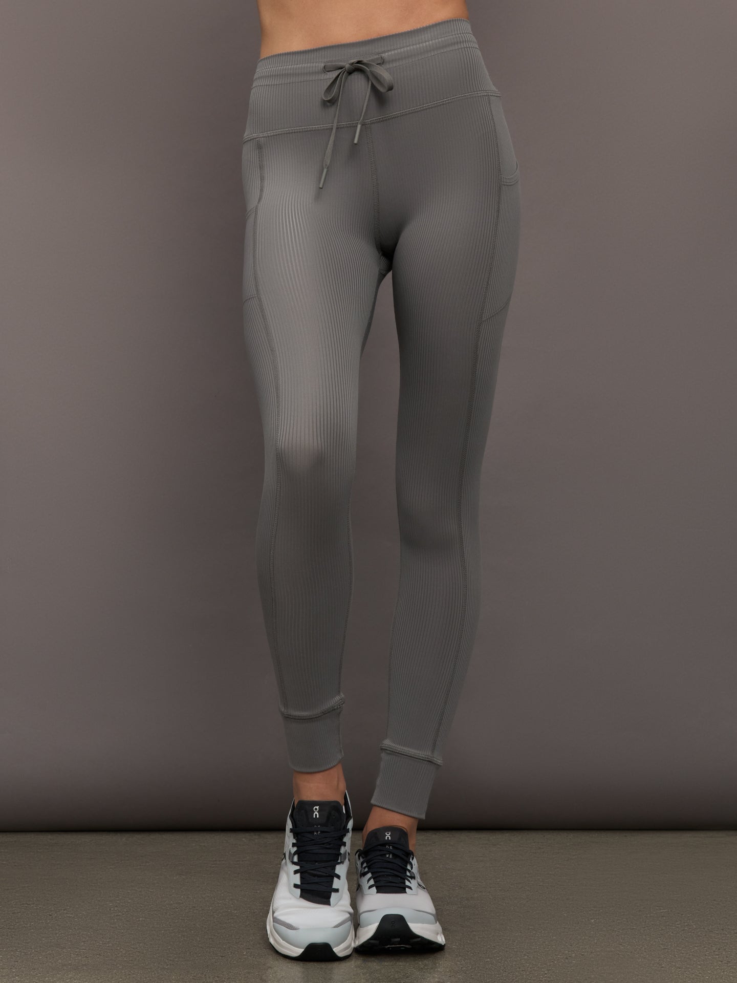 CARB-YD1008R-GREY-25FAL-Sport-Pocket-Legging-in-Ribbed-Melt-color-Steel-Grey_41101-Edit_38f8f64f-df85-4d34-8240-6863a31ed5b1 Model wears ribbed steel grey leggings with pockets.