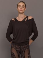 Model wearing brown off the shoulder long sleeve top