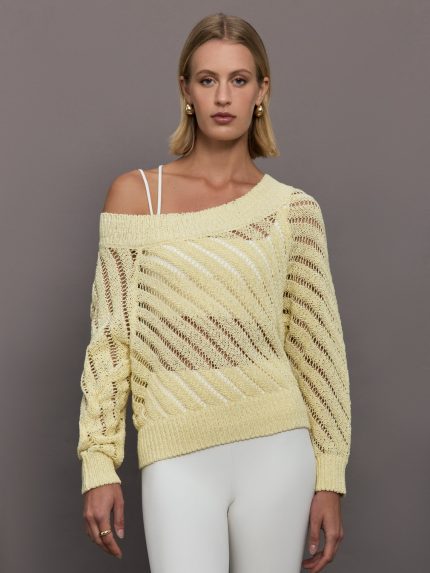 Model wears a yellow off shoulder mesh cardigan with diagonal pattern.  