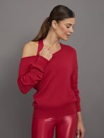 Model wears an off shoulder fire engine red fleece full length sweatshirt.