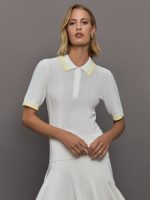 Model wears a lightweight and breathable polo tee shirt with yellow collar and sleeve details.