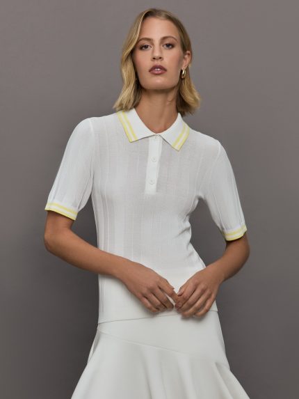 Model wears a lightweight and breathable polo tee shirt with yellow collar and sleeve details. 