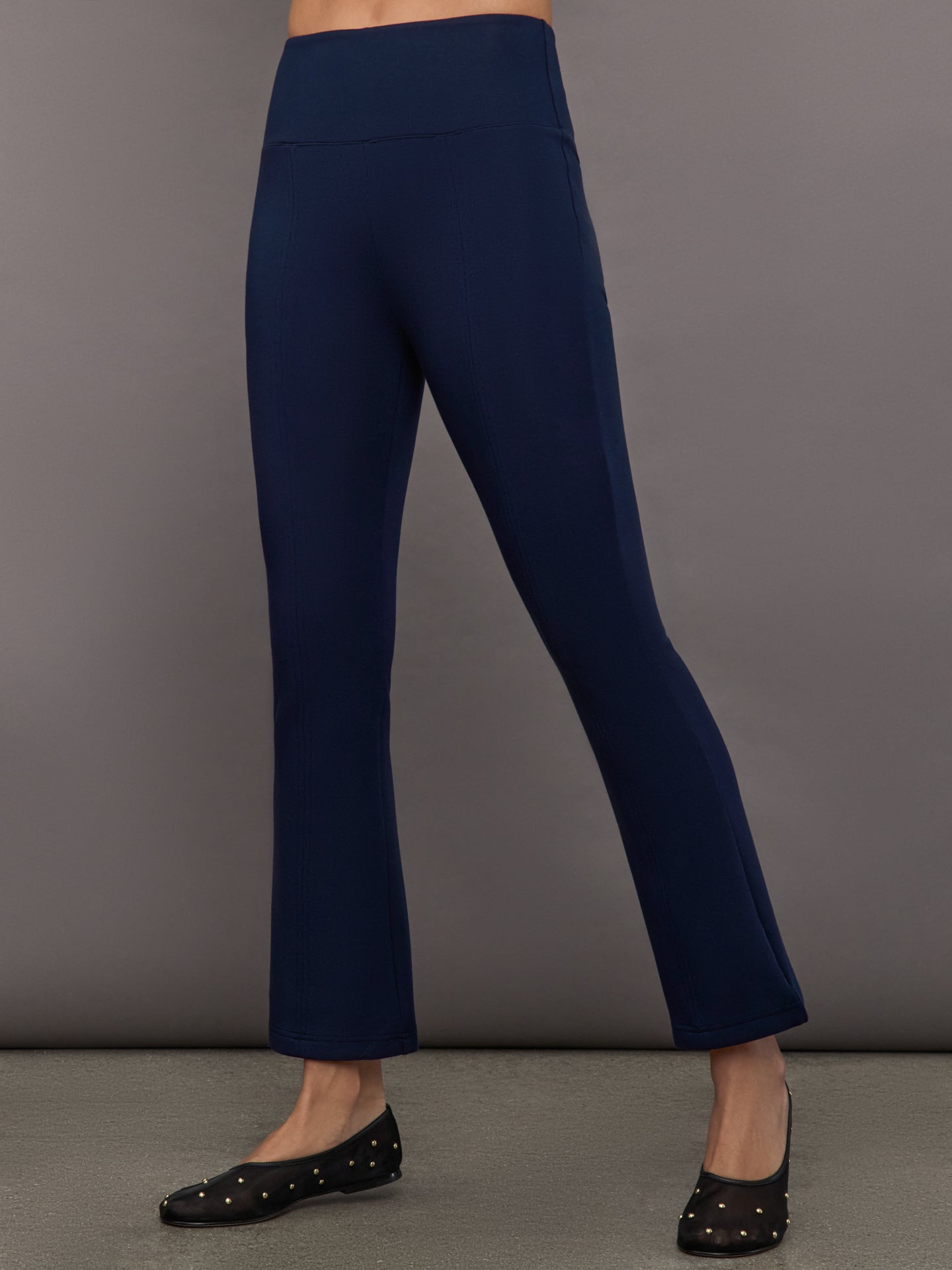 CARB-YD872-BLUE-25SS-Kick-Flare-Pant-in-Scuba-color-Navy_9976-Edit Navy high-rise pants with a fitted, sculpting silhouette through the hips and thighs, flaring out subtly at the hem.