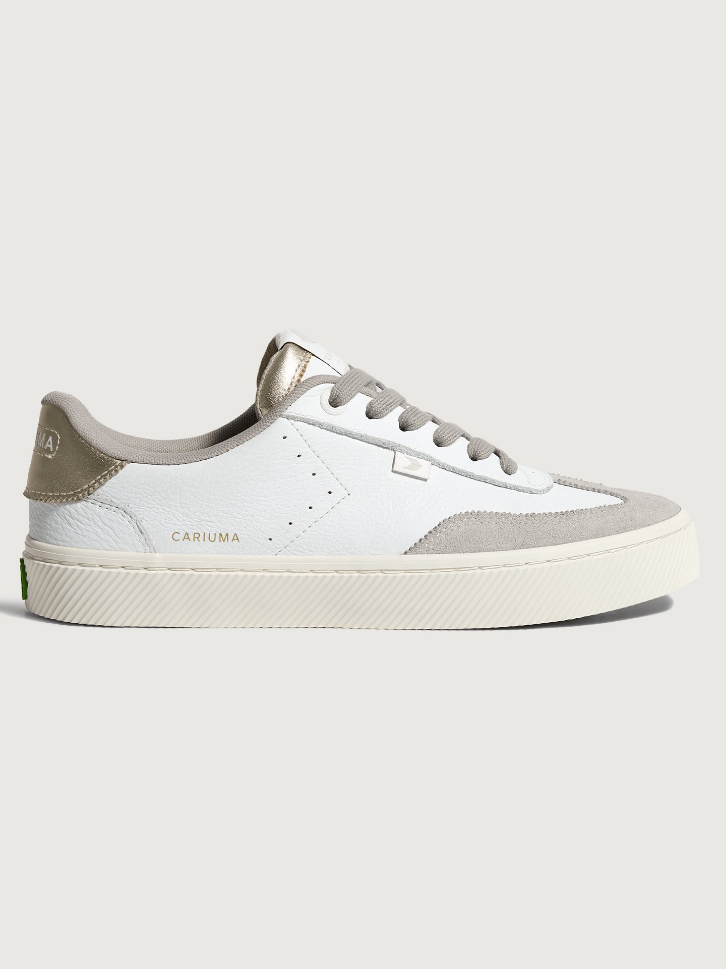 CARIU-613104W1N-WHTGOLD-Toca-Premium-Leather-Suede-color-White-Off-White-Vintage-Metallic-Gold3-Edit White and off-white colored sneakers with leather and suede materials, featuring a low-top design and lace-up closure.