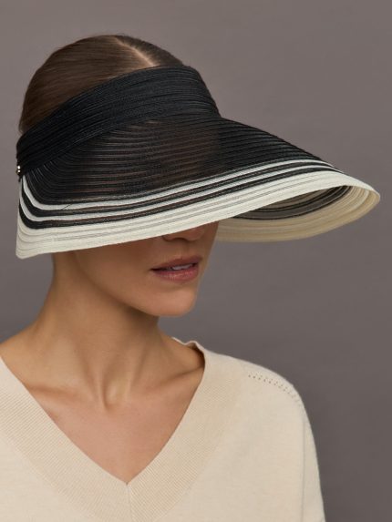 Model wears a black wide brim visor with white trim.