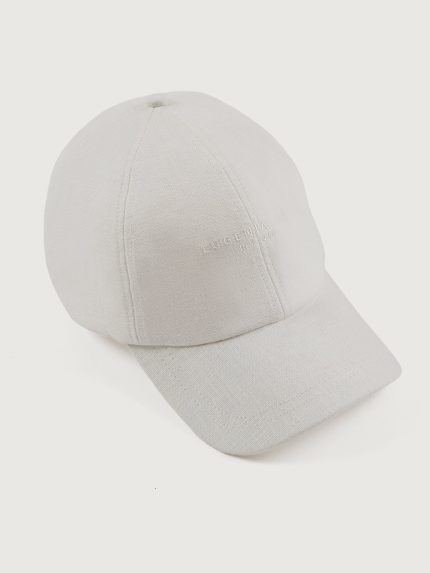 White linen baseball cap with an embroidered logo on the front and a ruched elastic back.