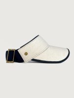 White linen visor with navy edging around front and top, black strap and gold hardware.
