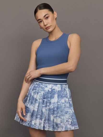 Model wears a sleeveless blue tank.