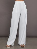 Model is wearing white trouser pants.
