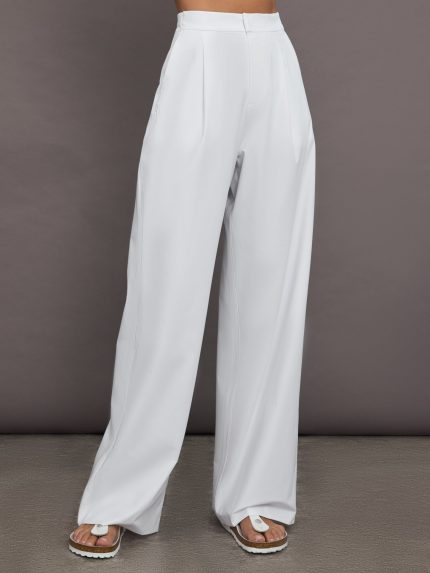 Model is wearing white trouser pants.