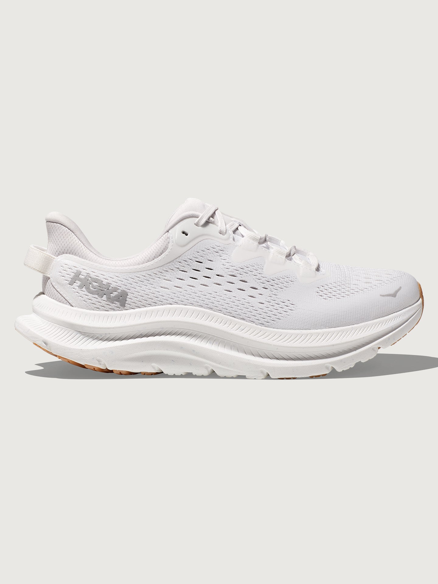 HOKA-1147913-WNCL-WHTOFFWHI-Kawana-2-color-White-Nimbus-Cloud-Edit White HOKA running sneakers with a mesh upper and a rubber outsole.
