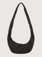 Black shoulder bag on a light gray background