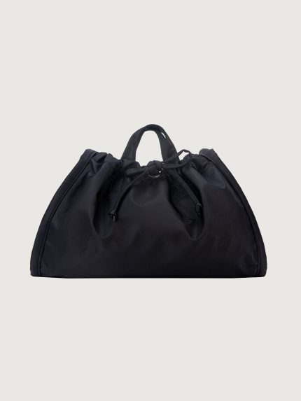 Black drawstring bag on a light gray background