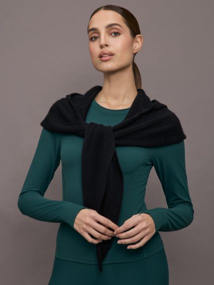 Model wears a black scarf over her shoulders.