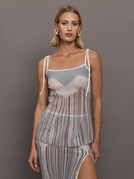 Model wearing a multicolor tank top with a loose fit and adjustable tie straps.