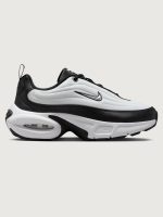 Black and white sneaker on a light gray background