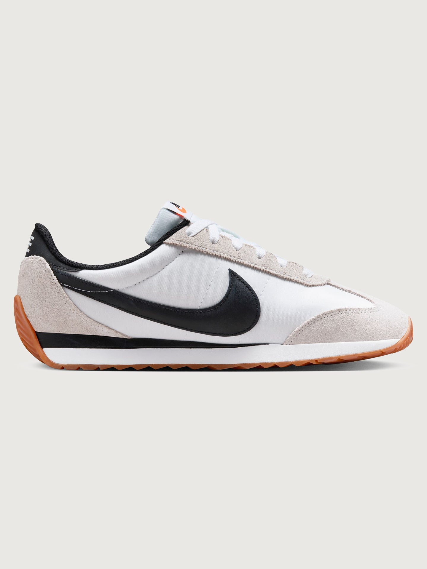 NIKE-HQ2052-100-WHTBLK-Nike-Pacific-color-White-Black-Platinum-Tint6-Edit White and black sneaker with a brown sole on a light gray background