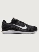 Black Nike training shoe with white sole on a light gray background
