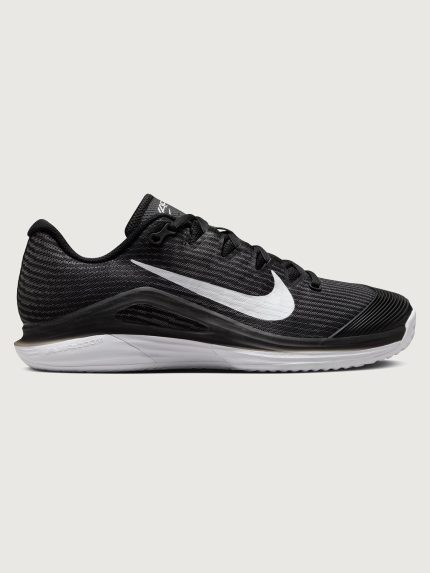 Black Nike training shoe with white sole on a light gray background