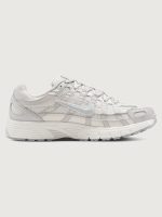 Gray sneaker with nike logo on a white background