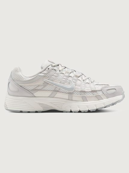 Gray sneaker with nike logo on a white background