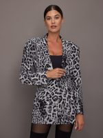 Model wearing a leopard print blazer.