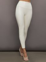 Model wears a high waisted cream colored legging/pant.
