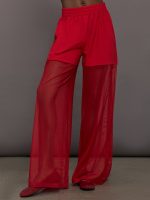 Model wears the Boyfriend Elephant Sweatpants in Tiger Red, featuring a relaxed fit with oversized legs, mesh detailing, and an elastic waistband.