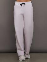 Model wears a pair of light purple sweatpants with black drawstring.