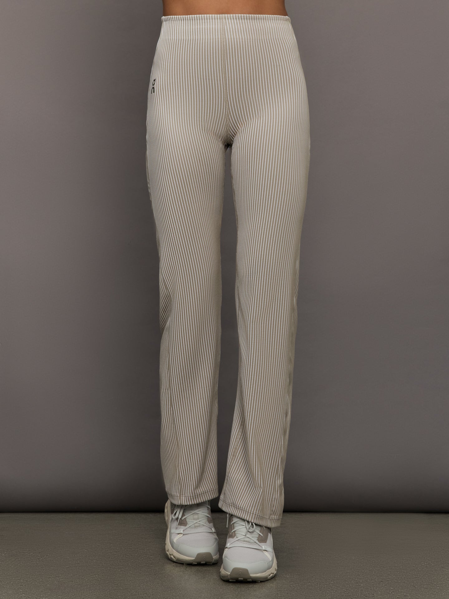 On-1WF30473961-NUDEWHI-All-day-Ribbed-Pants-color-Desert-White_48993-Edit Model wears a pair of high waisted straight leg neutral pinstripe pants.