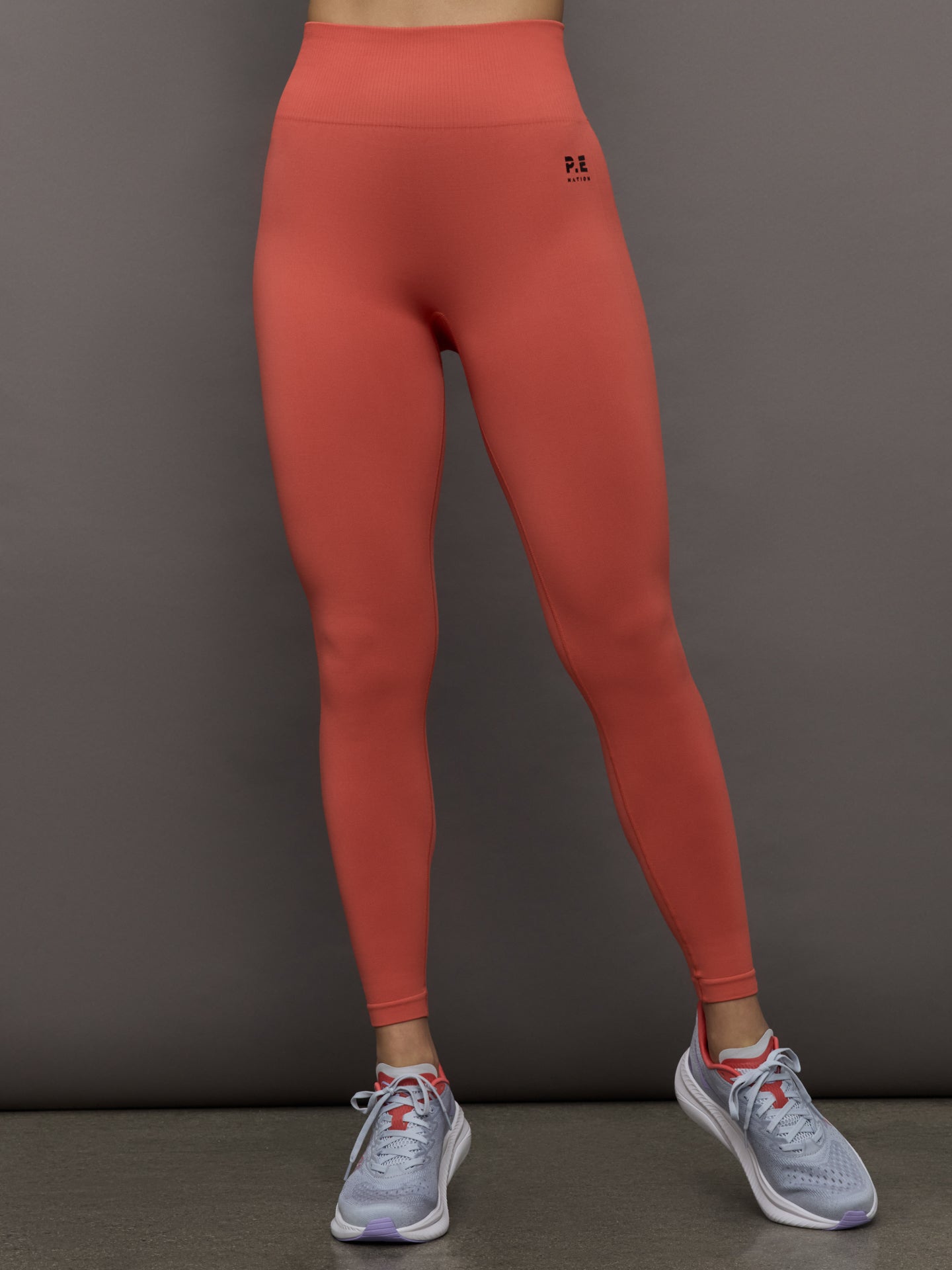 PENAT-243G295-REDREDDRK-Restore-Seamless-Legging-color-Brick-Red_7527-Edit Model wears a high waisted seamless full length brick colored legging.