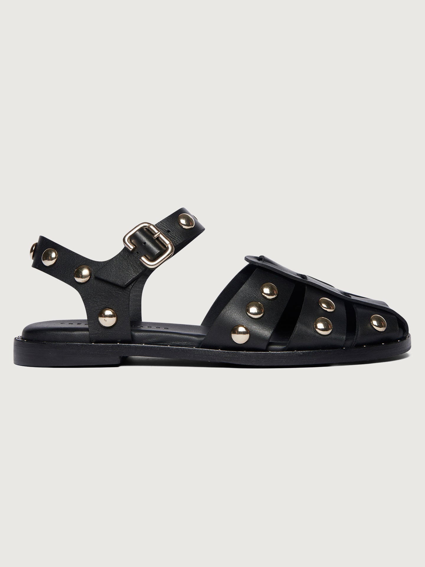 SERA_Black-Calf-with-Gold-Studs-Edit Black leather slingback sandal with round gold studs.