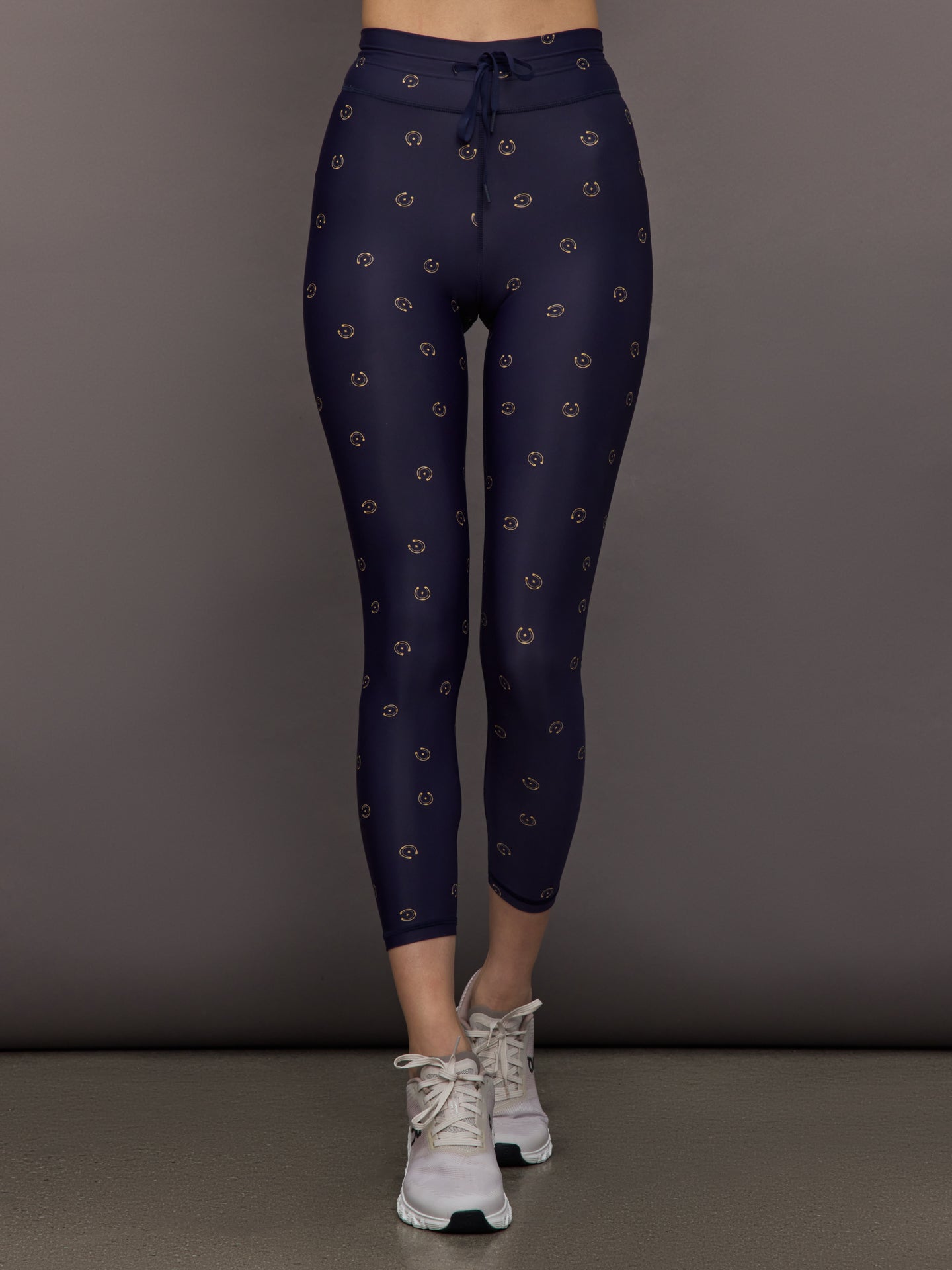 THEU-USW225096-MULTIMULTI-Cheval-28in-Midi-Pant-color-Novelty_1228-Edit Model wears navy leggings with a subtle horseshoe pattern.