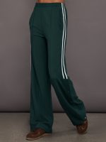 Green wide-leg track pants with white stripes