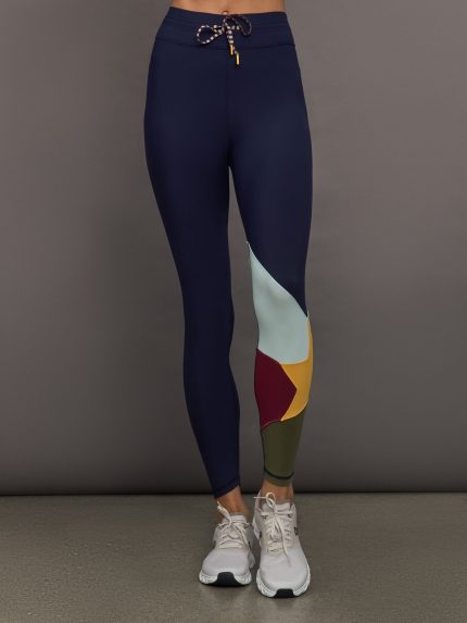 Model wearing Navy leggings with colorful abstract design.