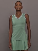 Model wears sage green tank top with a v-neckline and a fitted design.