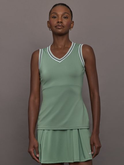 Model wears sage green tank top with a v-neckline and a fitted design.